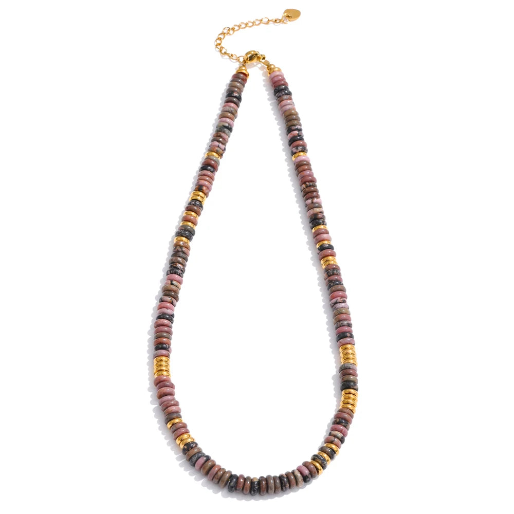 Necklace with multicoloured beads and gold accents on a white background