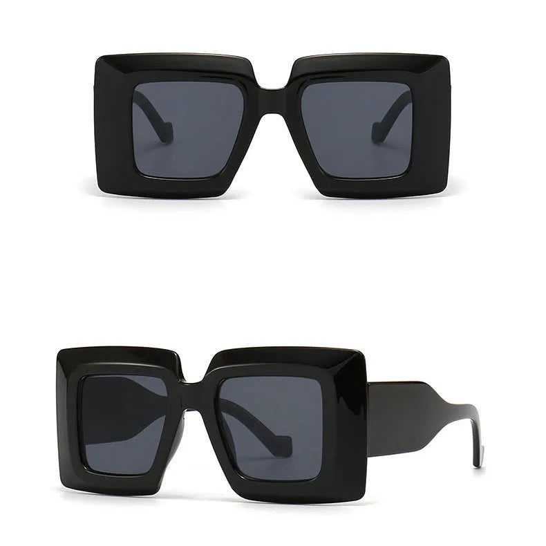 Black sunglasses with grey lenses on a white background
