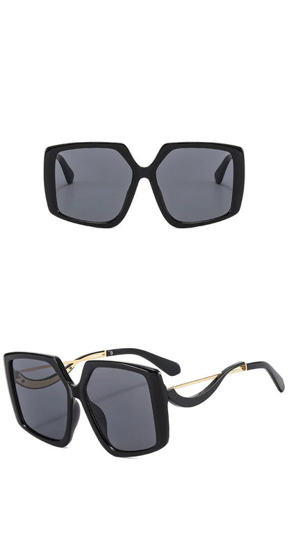 Black oversized square sunglasses with dark grey lenses, shown from the front and side angles on a white background.