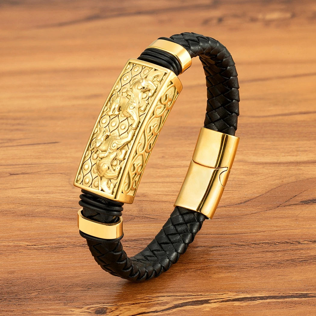 Gold and black braided bracelet on a wooden surface
