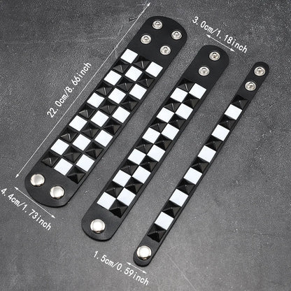 Three black leather bracelets with pyramid studs on a grey background with measurements.