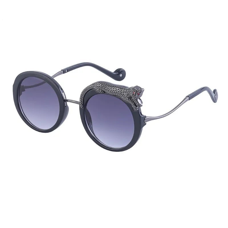 Sunglasses with round frame and gradient lenses on a white background