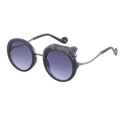 Sunglasses with round frame and gradient lenses on a white background