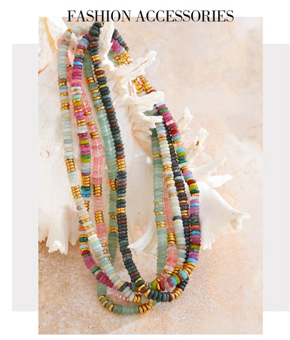 Colourful beaded necklaces on a textured surface 