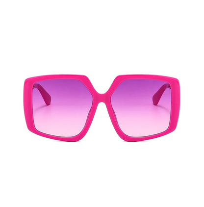 Bright pink oversized square sunglasses with purple gradient lenses, shown on a white background.