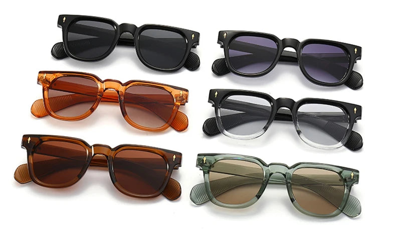 Set of six different coloured sunglasses on a white background