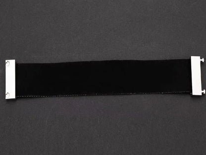 Black belt with silver buckle on a dark grey background