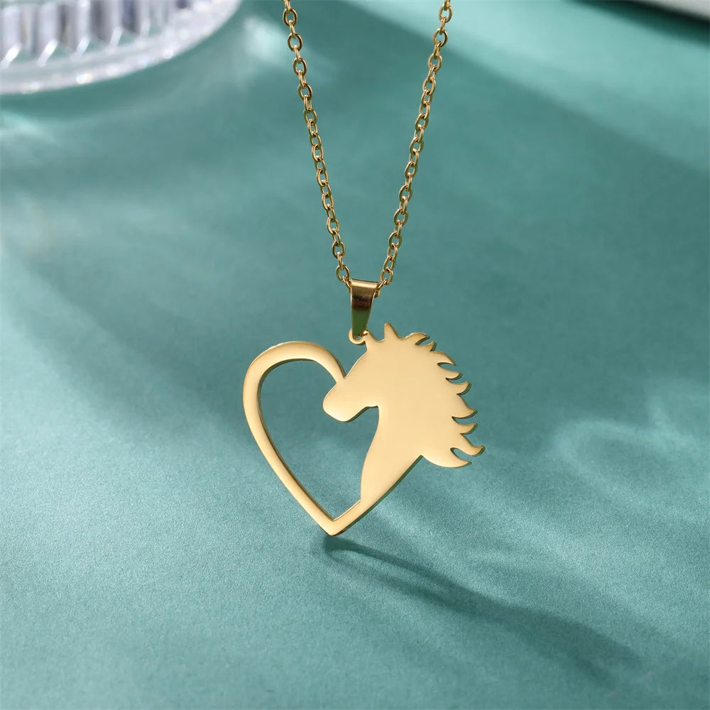 Gold necklace with a heart-shaped pendant featuring a horse design on a teal background