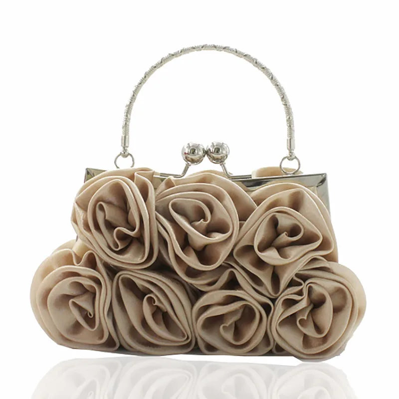 Beige rosebud handbag with a silver handle on a white background