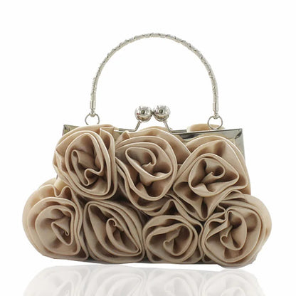 Beige rosebud handbag with a silver handle on a white background