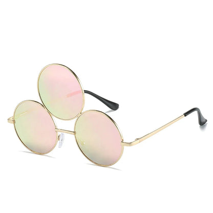 Round sunglasses with pink lenses and gold frames on a white background
