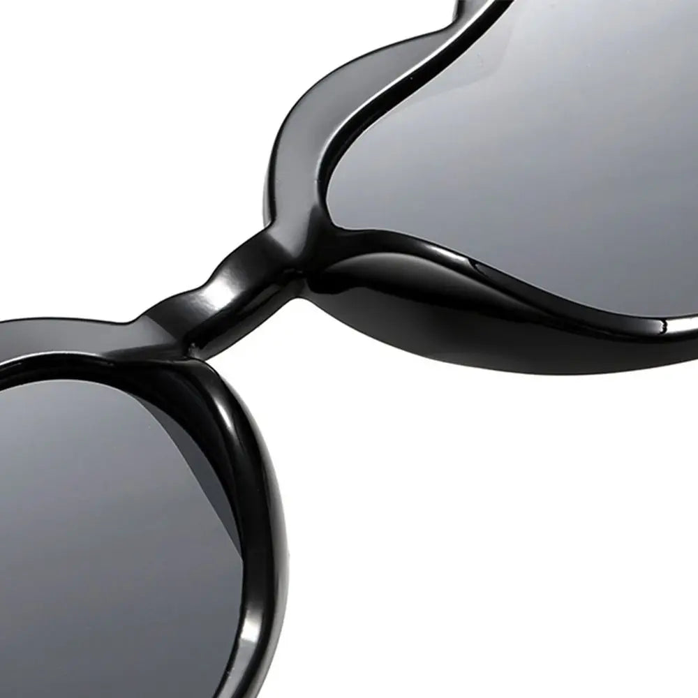 Close-up of a pair of sunglasses with reflective lenses on a white background