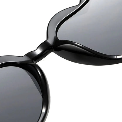 Close-up of a pair of sunglasses with reflective lenses on a white background