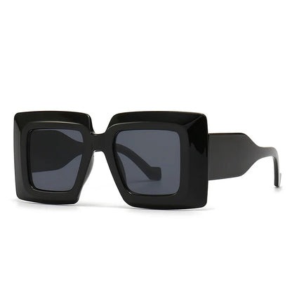 Black sunglasses with a square frame on a white background