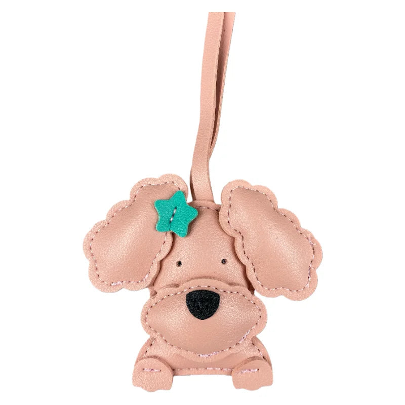 Pink dog-shaped keychain with a star on a white background