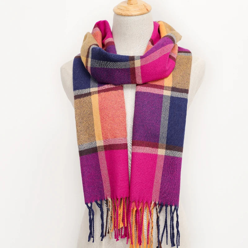 Colourful plaid scarf on a mannequin against a white background