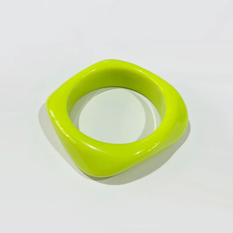 Green bangle on a white background