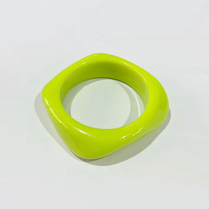 Green bangle on a white background