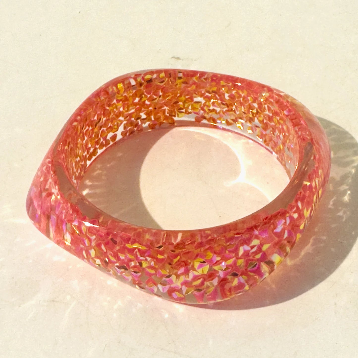 Multicoloured bangle on a light background