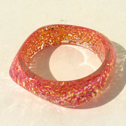 Multicoloured bangle on a light background