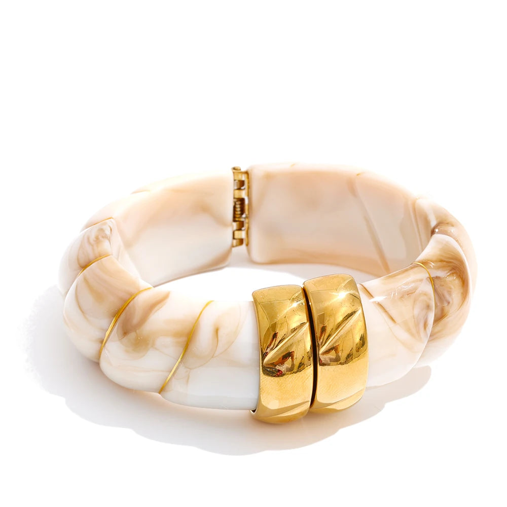 Bracelet with gold accents on a white background