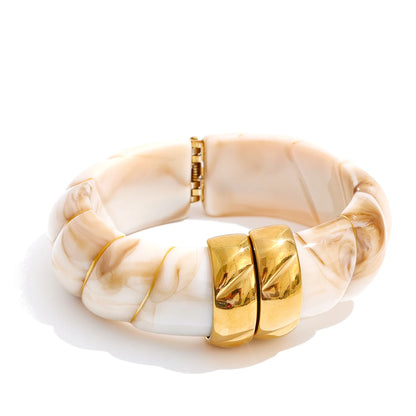 Bracelet with gold accents on a white background