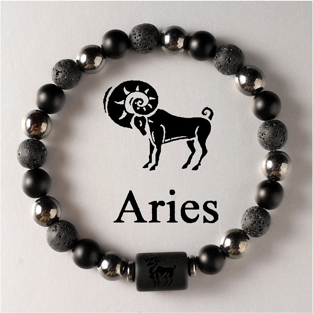 Black beaded bracelet with Aries symbol and text on a light grey background
