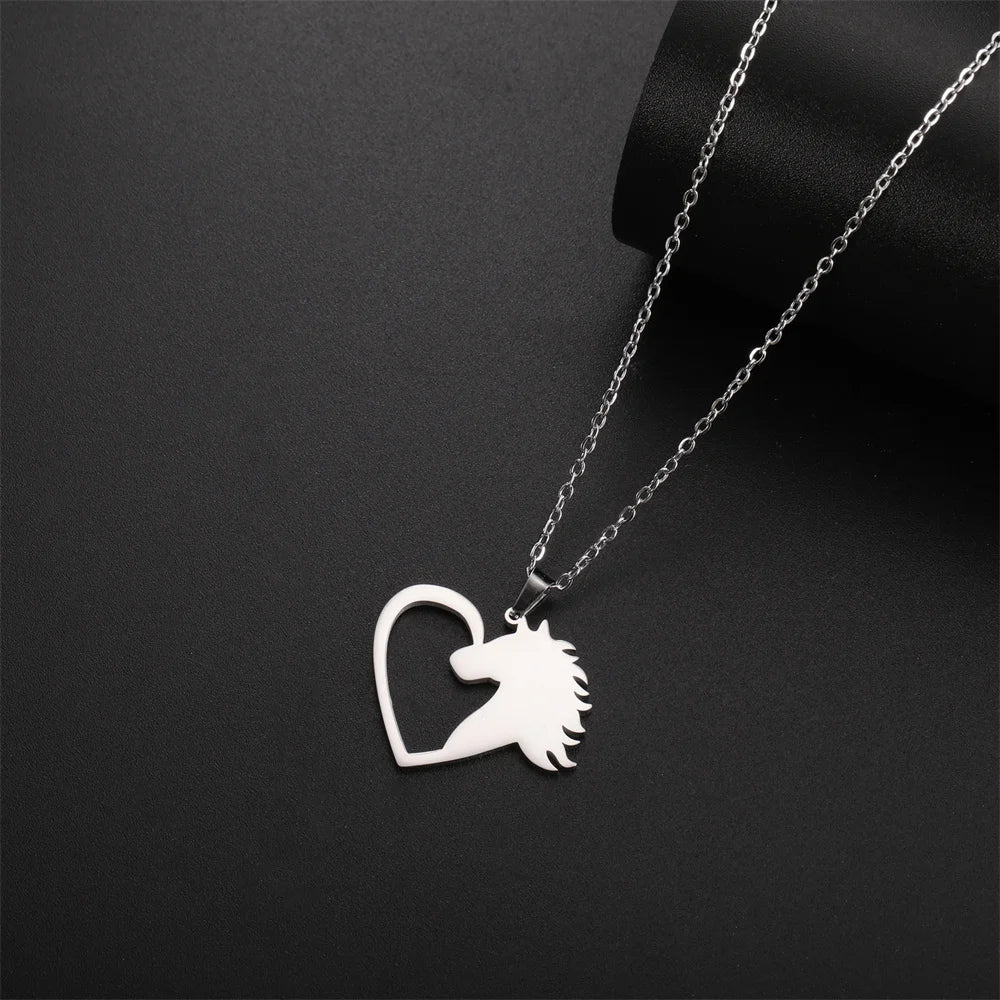 Silver necklace with a heart-shaped pendant featuring a horse design on a black background
