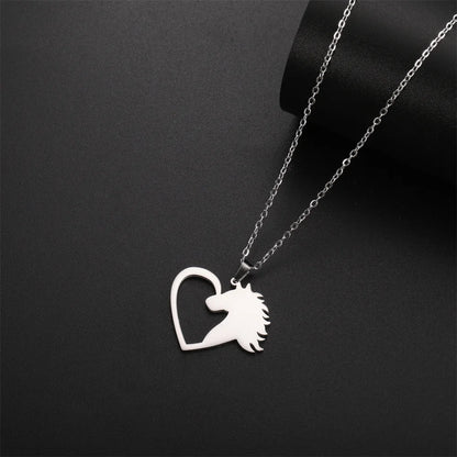 Silver necklace with a heart-shaped pendant featuring a horse design on a black background
