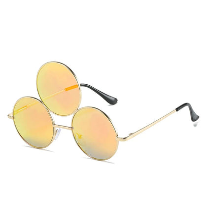 Round sunglasses with yellow lenses and gold frames on a white background