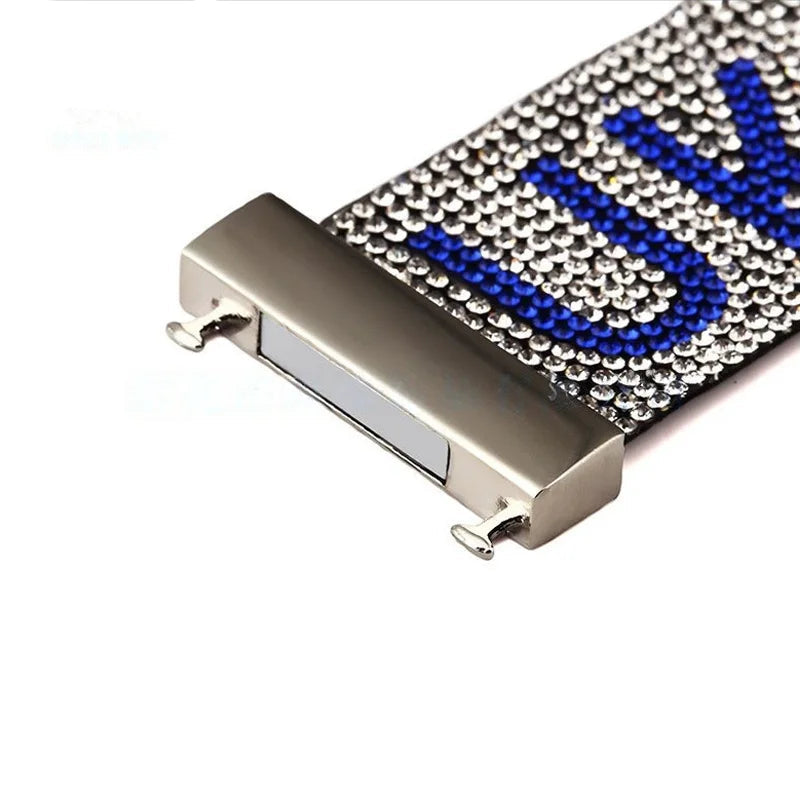 Close-up of a bracelet strap with blue accents on a white background