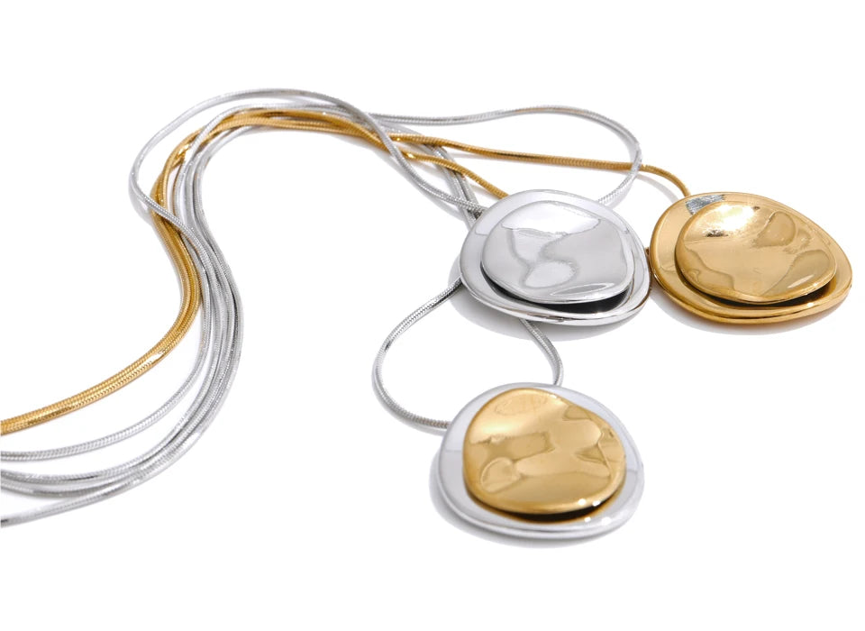 Gold and silver necklaces on a white background