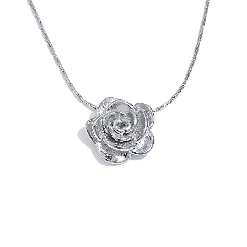 Silver rose-shaped pendant on a chain against a white background