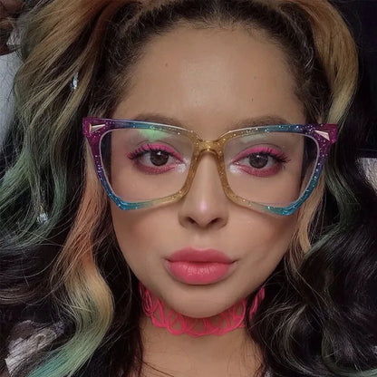 Close-up of a person wearing colourful glasses and a pink choker.