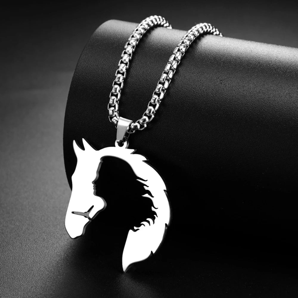 Silver horse head pendant necklace on a dark background