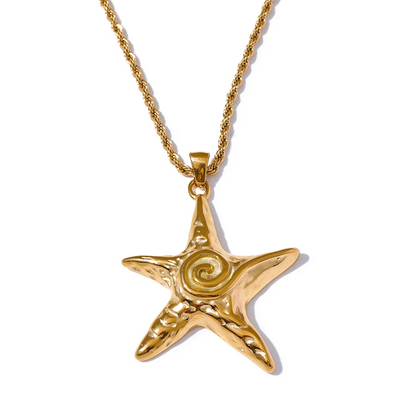 Gold starfish pendant necklace on a white background
