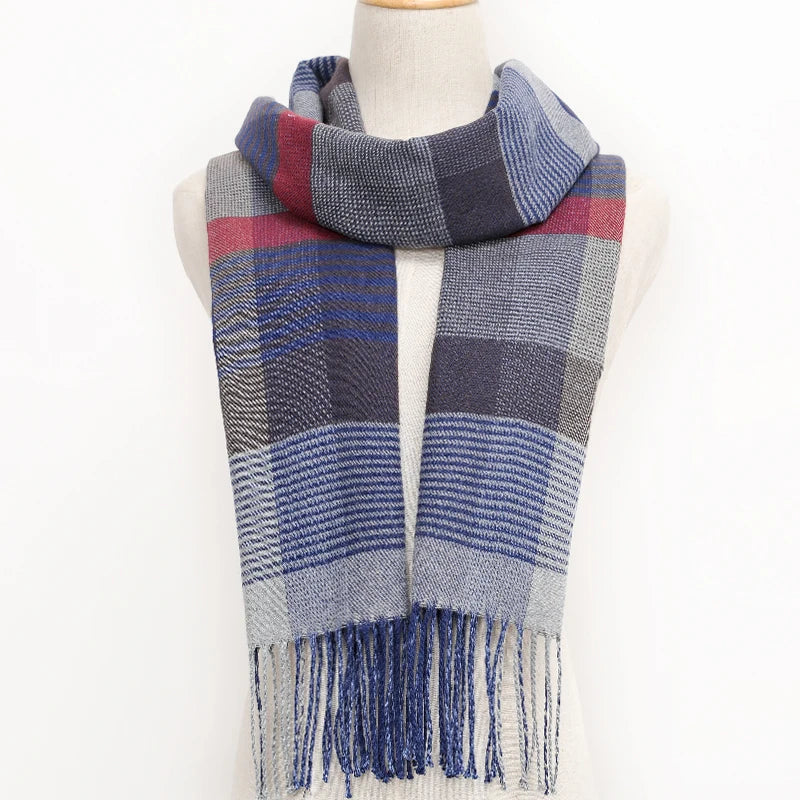 Plaid scarf with blue, red, and grey colours on a mannequin against a white background