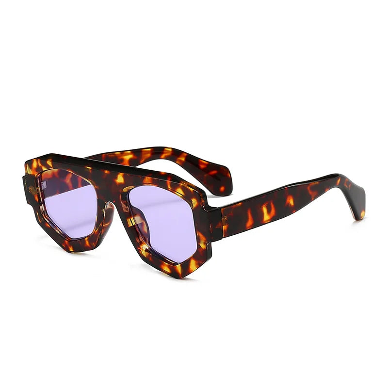 Sunglasses with tortoiseshell frame and purple lenses on a white background