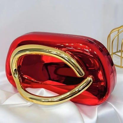 Red and gold handbag on a white fabric background