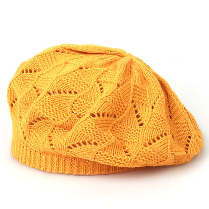 Orange knitted beanie on a white background