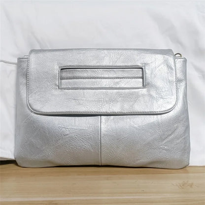 Silver clutch bag on a white background