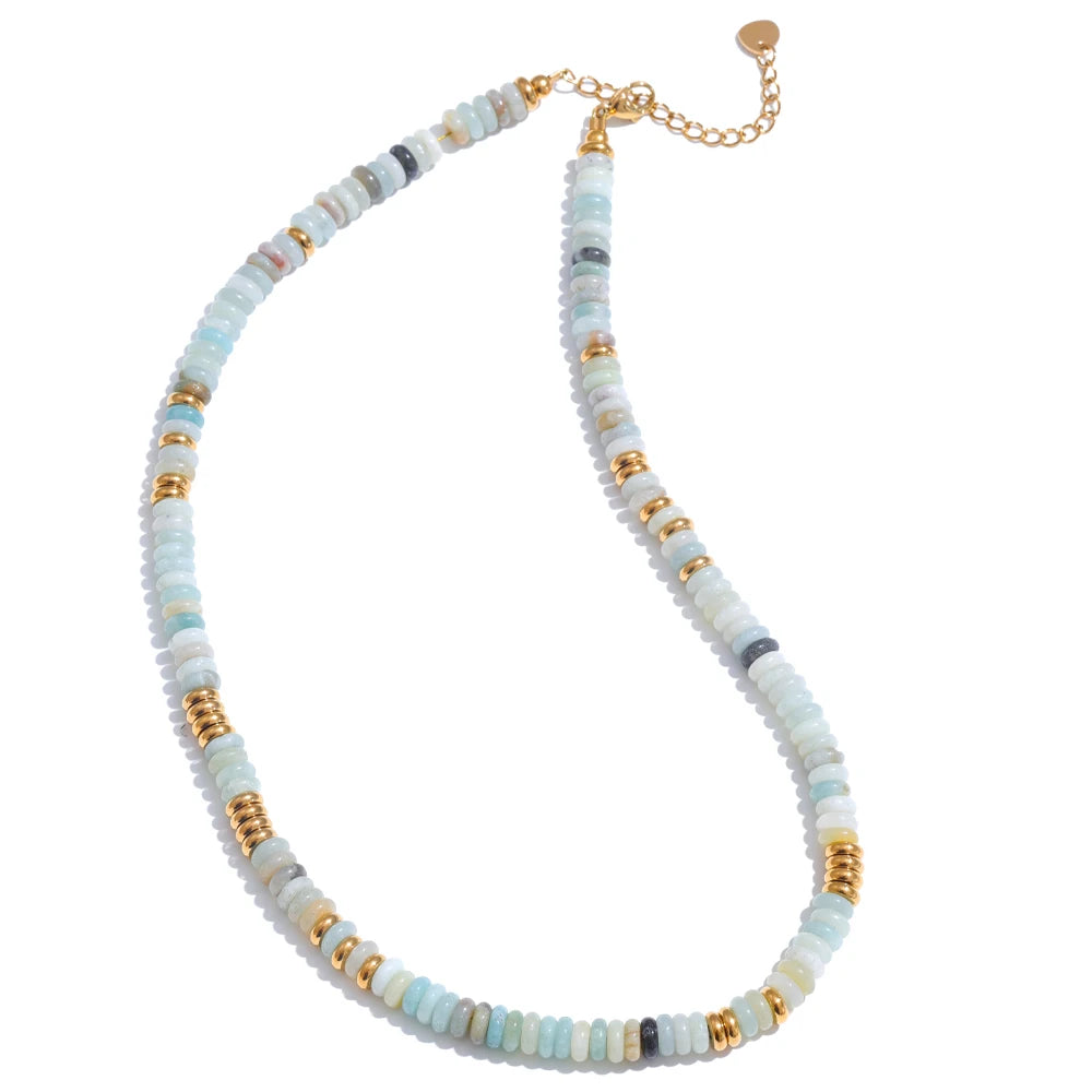 Necklace with multicoloured beads and gold accents on a white background