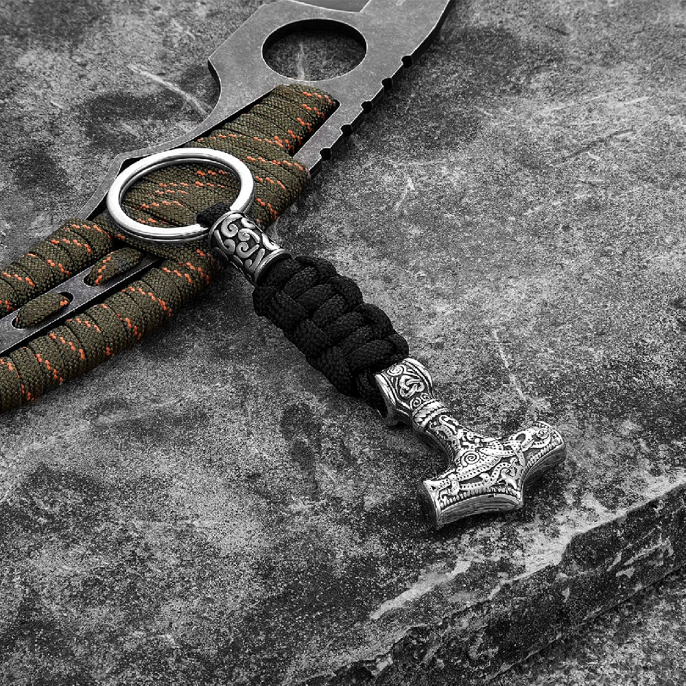 Keychain with hammer design on a textured surface