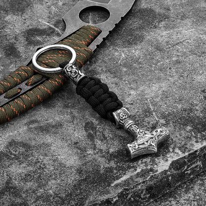 Keychain with hammer design on a textured surface