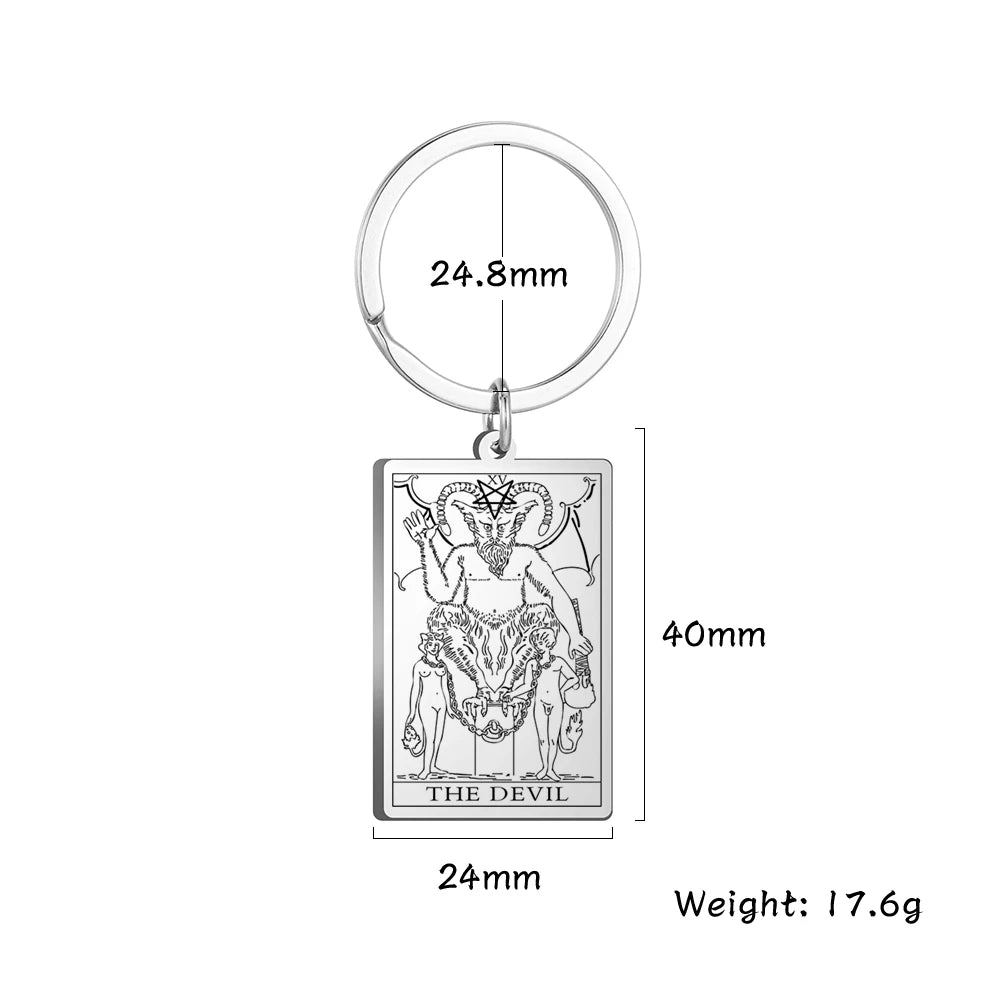 Keychain with 'The Devil' tarot card design and measurements on a white background