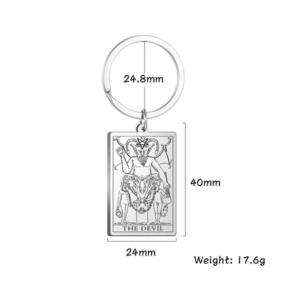 Keychain with 'The Devil' tarot card design and measurements on a white background