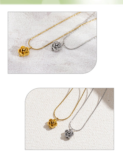 Two necklaces with floral pendants on a textured surface
