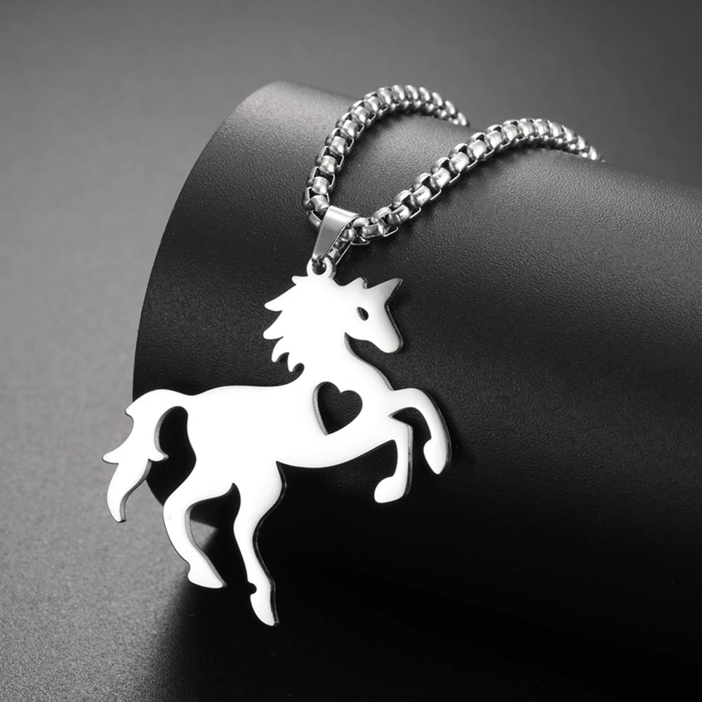 Silver horse-shaped pendant on a chain against a dark background