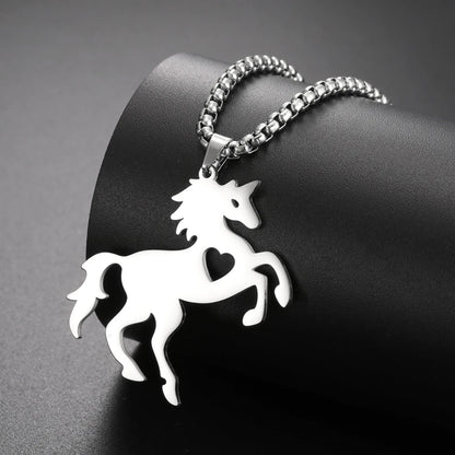 Silver horse-shaped pendant on a chain against a dark background