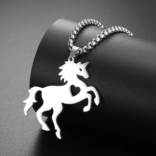 Silver horse-shaped pendant on a chain against a dark background